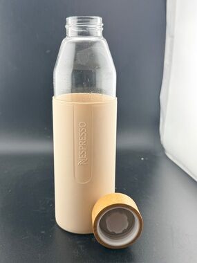 Nespresso Glass Bottle with Beige Sleeve and Tan Cap